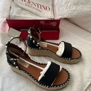 Valentino Garavani black grained leather d'Orsay espadrille sandal.